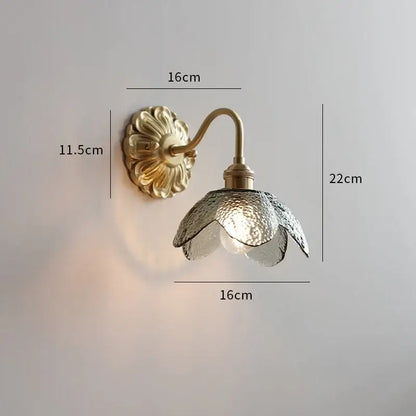 Gold-toned antique brass ceramic led wall light with ribbed open flower glass shade for bedroom decorbites ceramic led wall