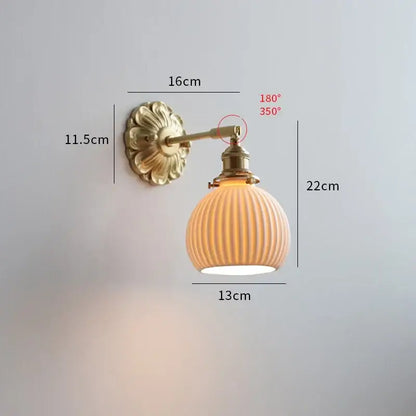 Antique brass ribbed glass wall lights with warm-toned shade are elegant bedroom sconces for decorbites ceramic ball led