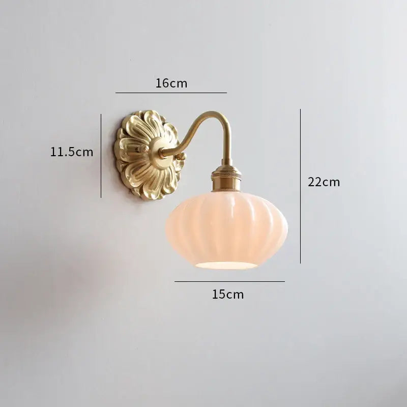 Antique brass ribbed glass wall lights featuring a floral backplate and soft peach shade ideal for bedroom decorbites ceramic ball led