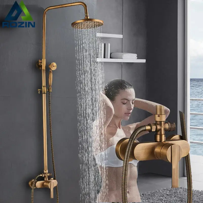 Antique brass shower faucet with handshower featuring gold-finished brass rainhead and handheld sprayer for bathroom use