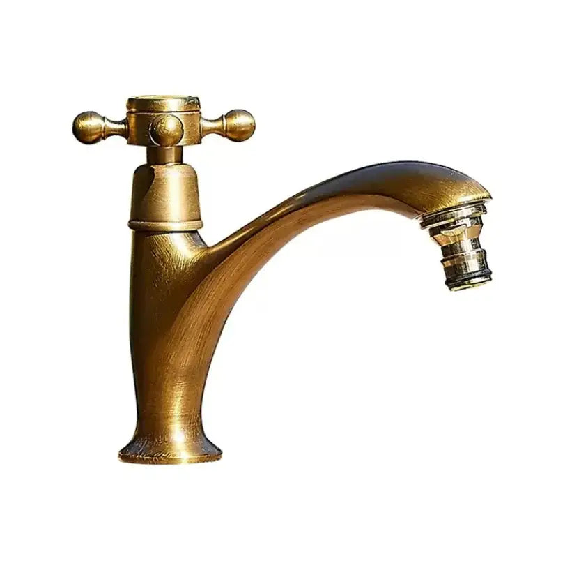 Antique brass single handle basin faucet with curved spout and cross-shaped handle for bathroom use