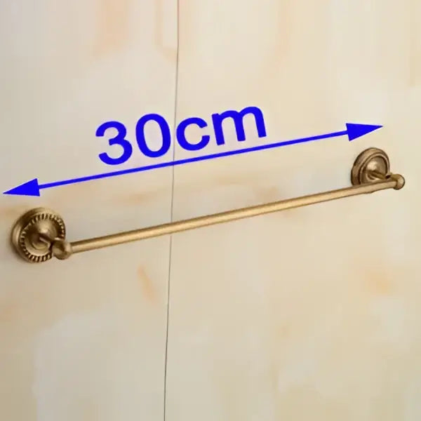 Antique brass single towel bar with ornate scrollwork ends and a 30cm length for bathroom decor