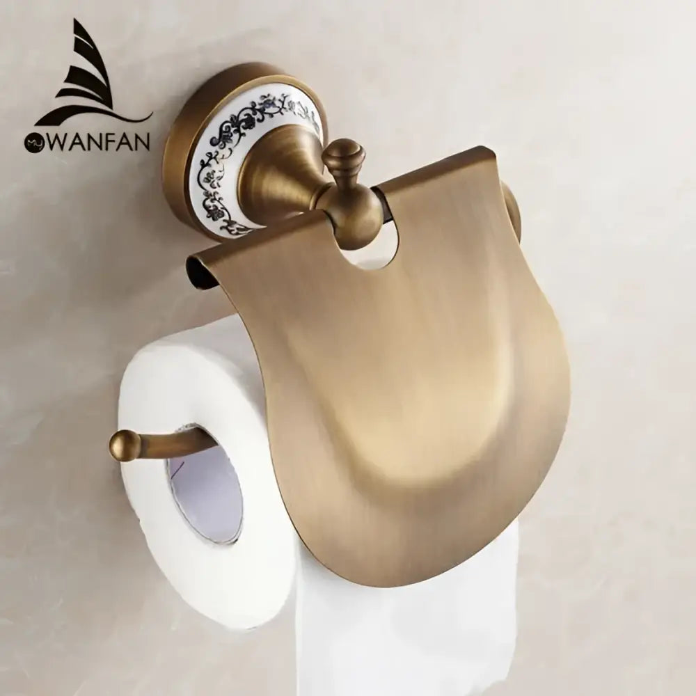 Antique brass wall mounted paper holder with decorative ceramic base and elegant curved metal cover for bathroom decorbites brass wall