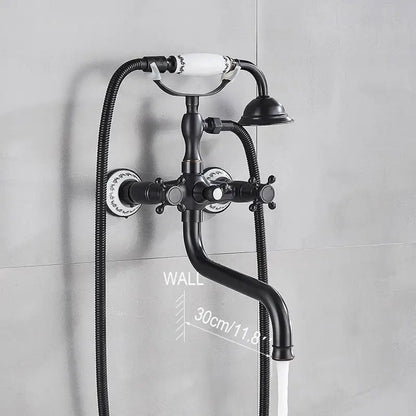 Black matte vintage-style wall-mounted decorbites dual handle bathtub faucet with white ceramic handles and floral patterns