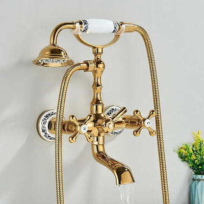 Gold-finished antique brass and white dual handle bathtub faucet with ceramic handle and blue-and-white porcelain decorbites accents
