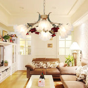 Antique brass and white porcelain DecorBites™ chandelier with red floral accents for living room ceiling lighting