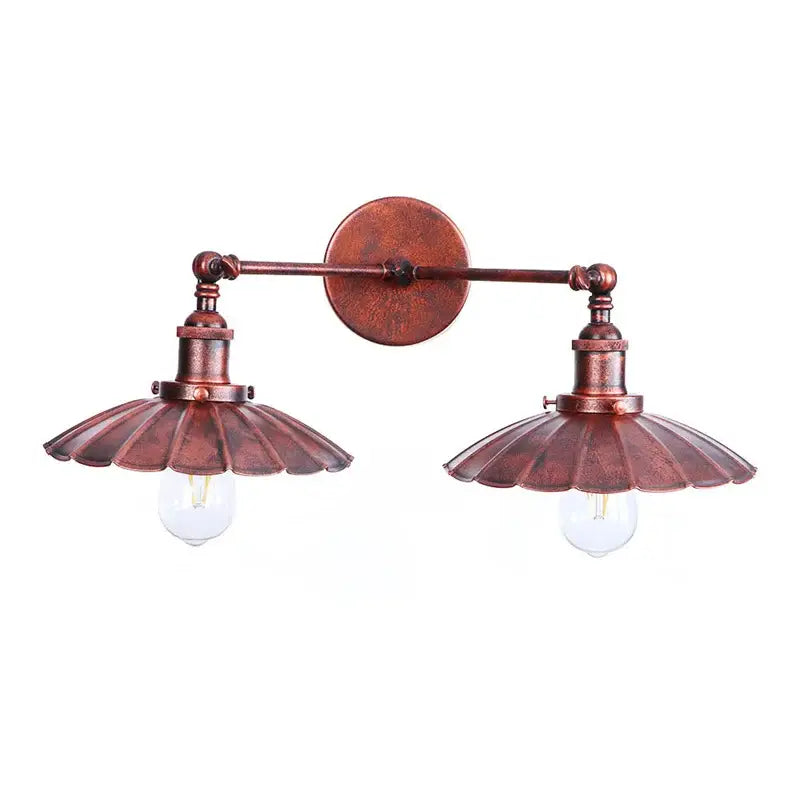 Copper-toned antique bronze adjustable rustic led wall lamp with two fluted scalloped shades and exposed bulb sockets