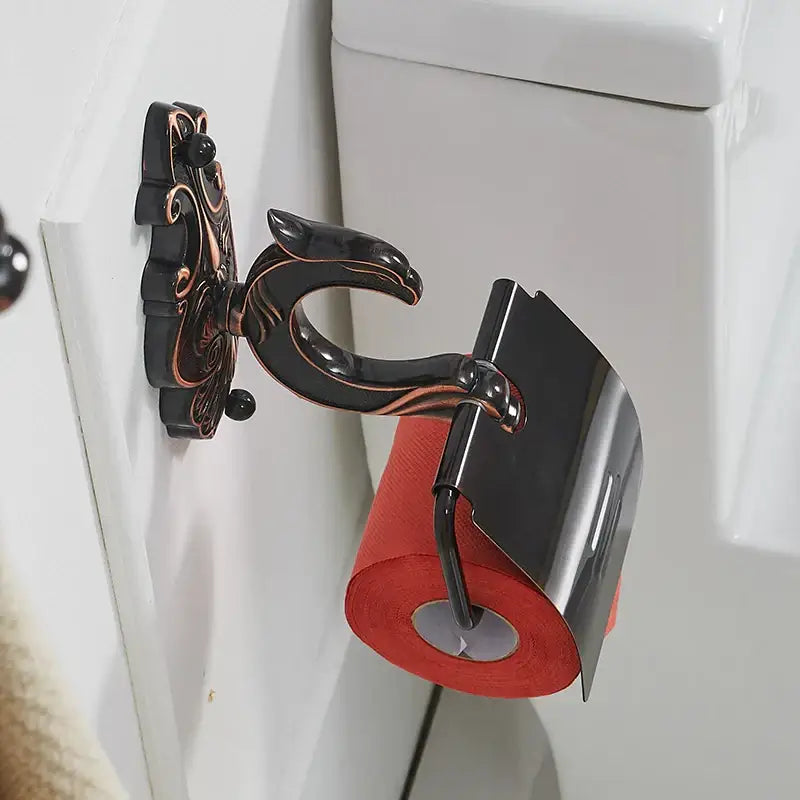 Black and copper-toned ornate antique bronze and black toilet paper holder with sleek curved design by decorbites black brass