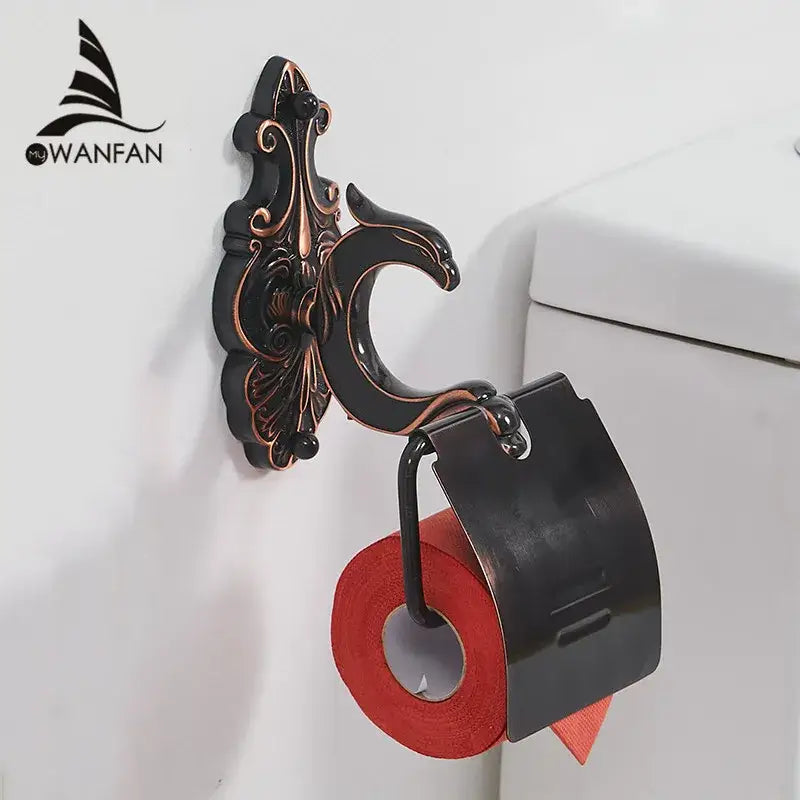 Ornate decorbites black brass toilet paper holder in antique bronze and black metal with decorative sculptural design