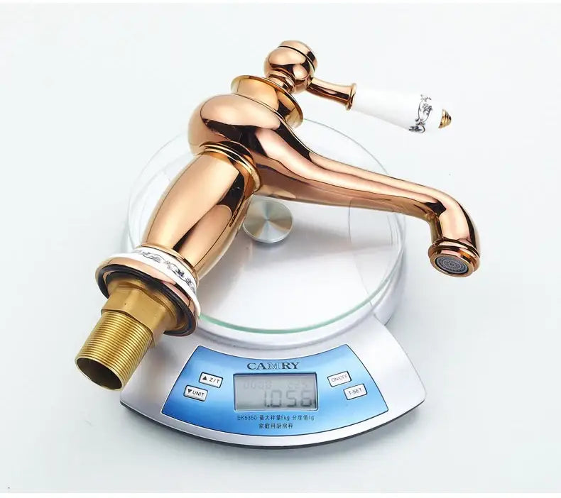 Decorbites antique bronze single handle bathroom faucet with polished rose gold finish and ceramic handle real shot details
