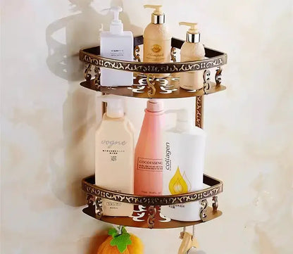 Brass-colored ornate two-tiered bathroom shelf with decorative scrollwork edges in decorbites bronze carved bath set