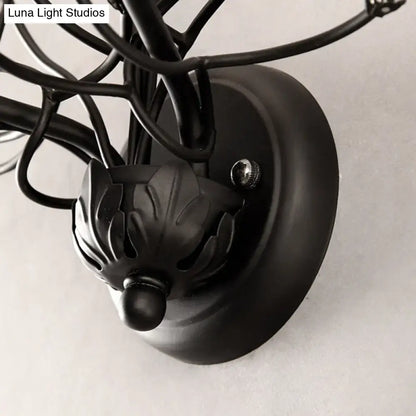 Black wrought iron wall light with leaf finial and crystal accents for e12 e14 bulbs in antique bronze finish