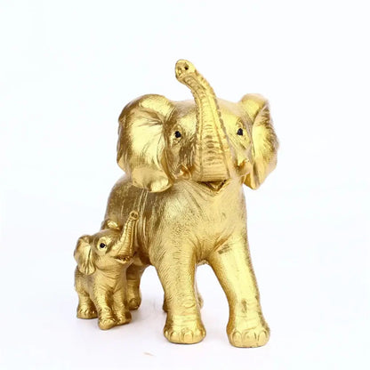 Golden resin elephant family figurine with textured skin and black bead eyes, perfect for living room décor