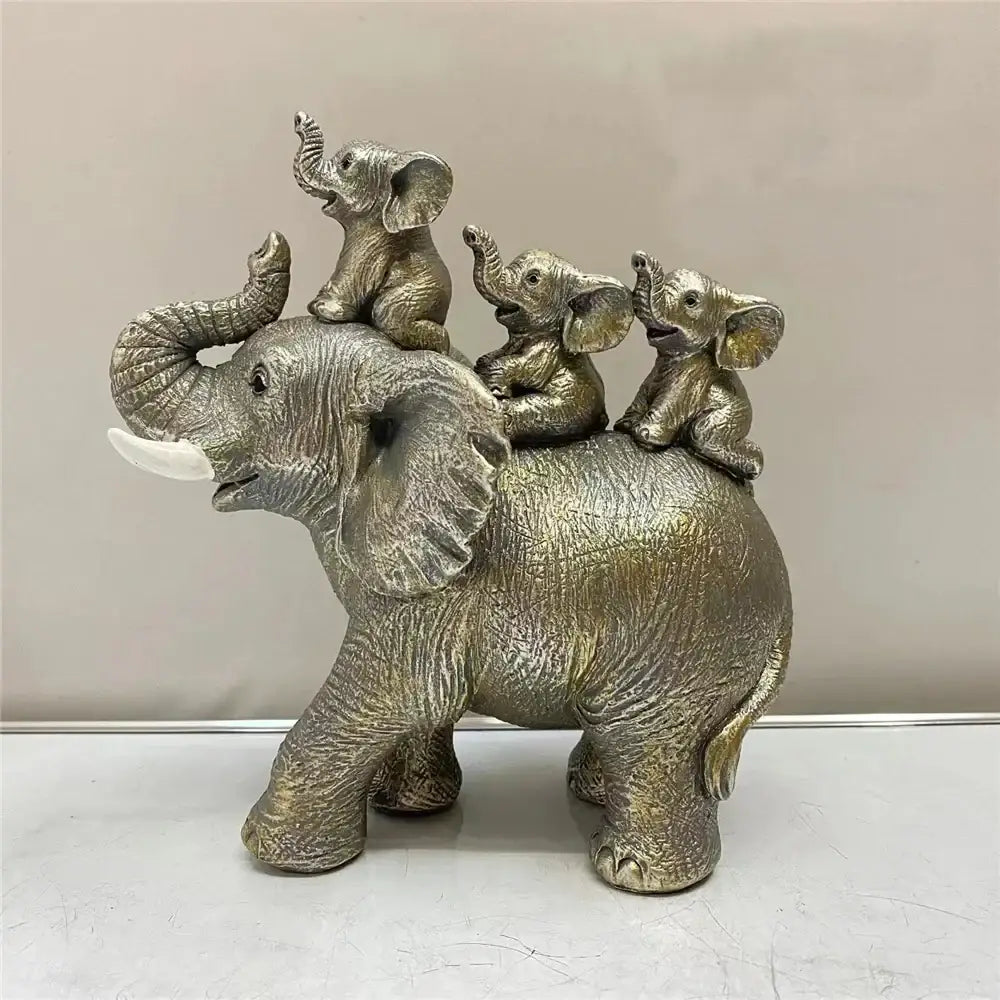 Silver-toned resin elephant family figurine with textured skin and white tusks for living room ornament