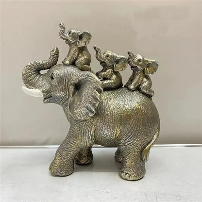 Silver-toned resin elephant family figurine with textured skin and white tusks for living room ornament