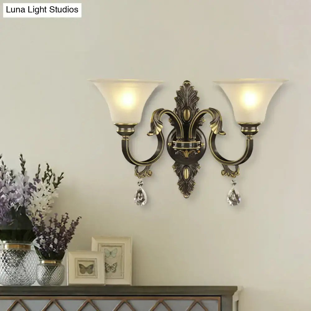 Antique bronze wall mounted two-light fixture with frosted glass shades and gold crystal droplets for bedroom e26 e27