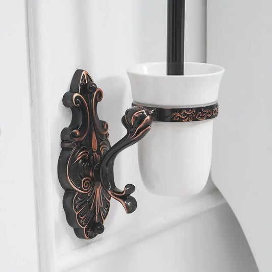 Antique bronze ornate wall-mounted toilet brush holder with a white ceramic cup for bathroom brush holder set