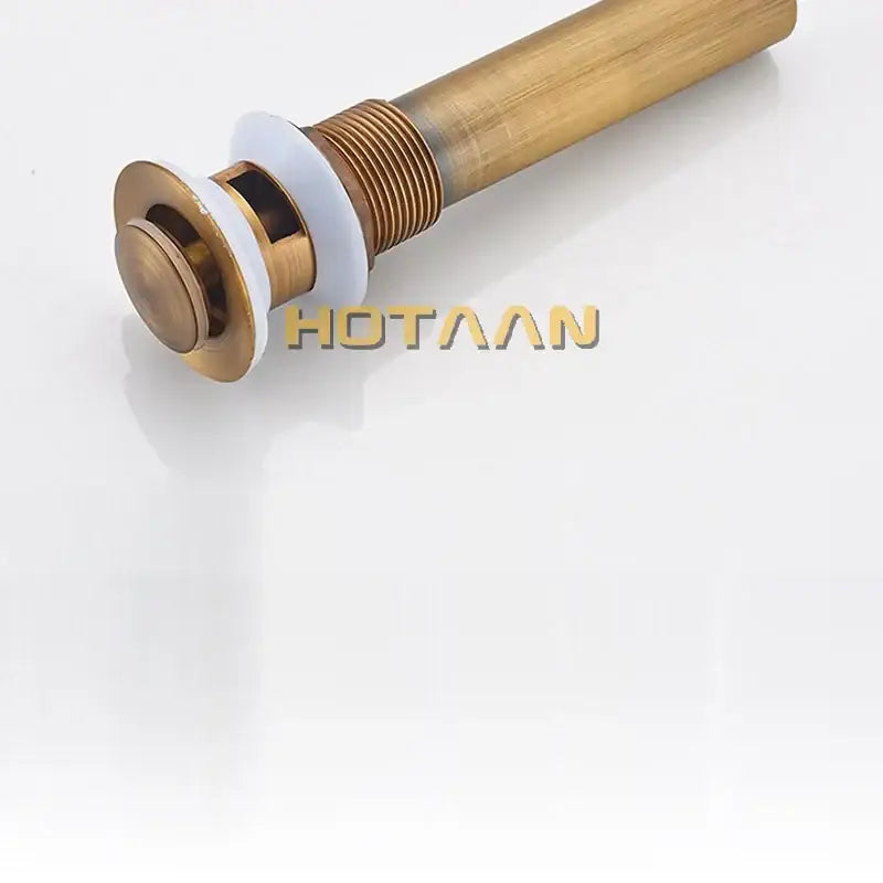 Antique brushed brass pop up sink drain with white rubber gasket and threaded metal stem decorbites brass pop stopper