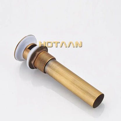 Antique brushed brass pop up sink drain with white ceramic stopper and threaded metal body decorbites brass pop in gold tone