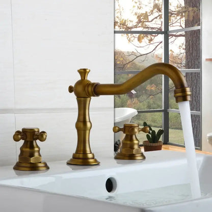 Antique brass-finished three-handle basin faucet with ornate vintage design and curved spout by decorbites dual handle
