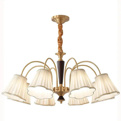 Antique copper chandelier with six cream pleated fabric shades and dark wood accents for dining room lighting