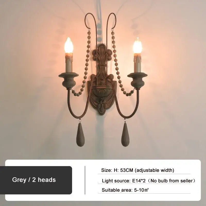 Antique country french wall lamp with grey metal sconce, two candle arms, beaded chains, and teardrop pendants decorbites country french wall