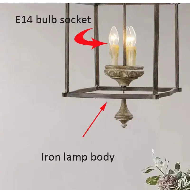 Antique dark bronze creative american iron chandelier light with two candle-shaped bulbs in distressed metallic finish