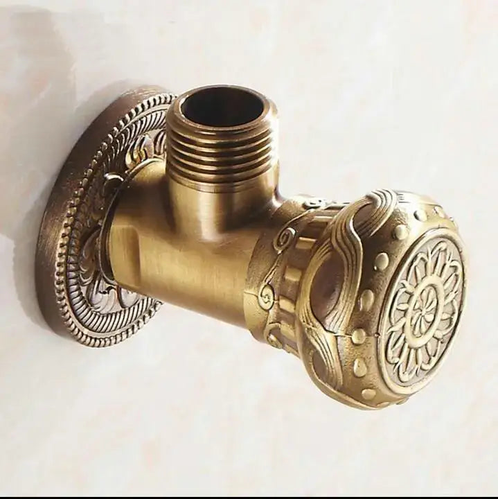 Antique floral brass bathroom angle stop valve with brass finish and intricate floral and scrollwork embossing angle stop valve