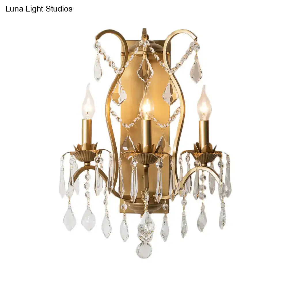 Antique gold candelabra wall light with gold finish and clear crystal droplets for elegant dining room decor