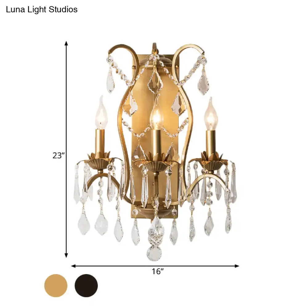 Antique gold candelabra wall light with three candle-style lights and crystal droplets for dining room wall light