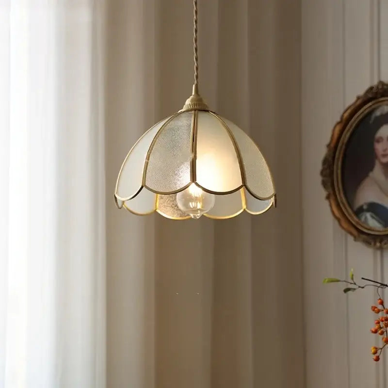 A cream-colored antique glass led pendant lamp with gold petal-shaped frame for kitchen lighting fixture