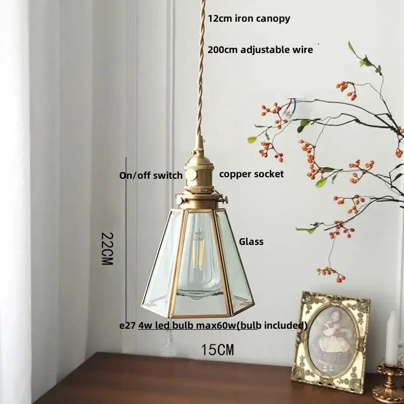 Antique brass-finished pendant lamp with clear glass led panels and visible bulb for kitchen lighting fixture