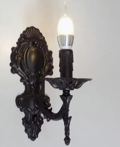 Black ornate wrought iron creative retro european wall sconce with candle-style bulb for elegant bedroom lighting