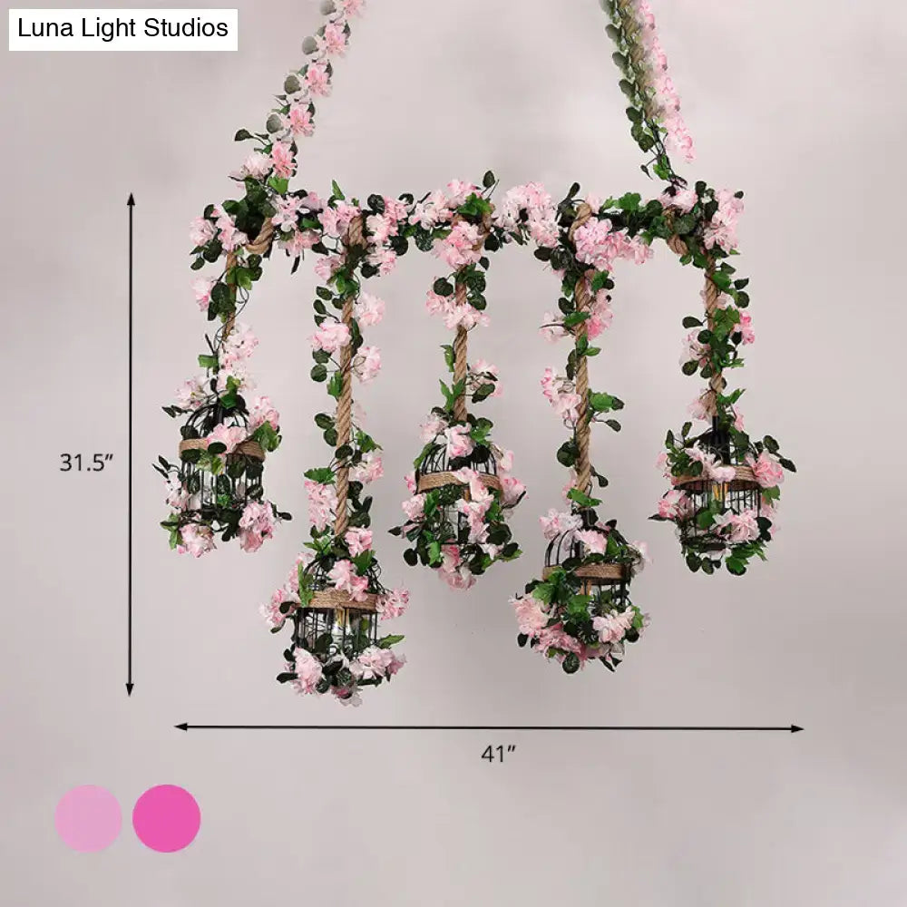 Decorbites antique metal island ceiling light with five ornate birdcages featuring light pink cherry blossom flowers