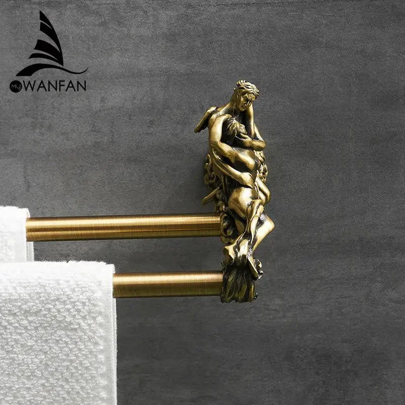 Antique ornate gold and silver brass double towel bars with a sculpted couple decorative end cap for bathroom use