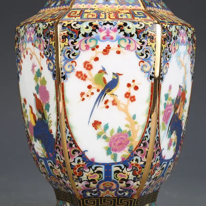 Hexagonal porcelain vase with intricate enamel bird and blossom paintings in vibrant colors with gold trim from vase collection