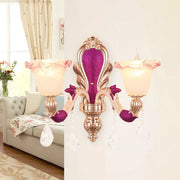 Elegant antique purple and gold double head mount light fixture with pink frosted glass shades and crystal droplets for bedroom