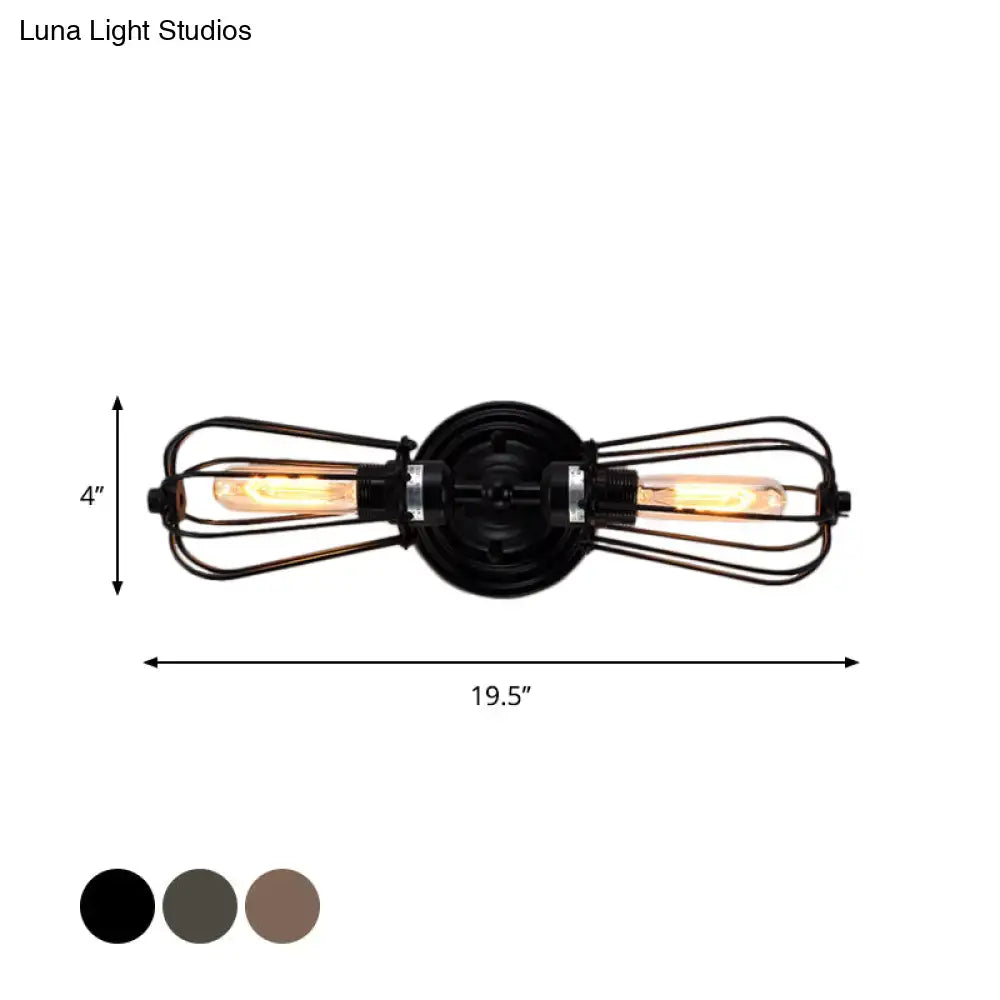 Antique style black bronze wrought iron sconce light with two exposed filament bulbs in wire cages for dining room