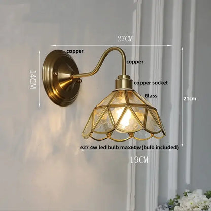 Antique teal glass and brass wall light fixture with geometric glass shade designed as a bedroom wall light sconce