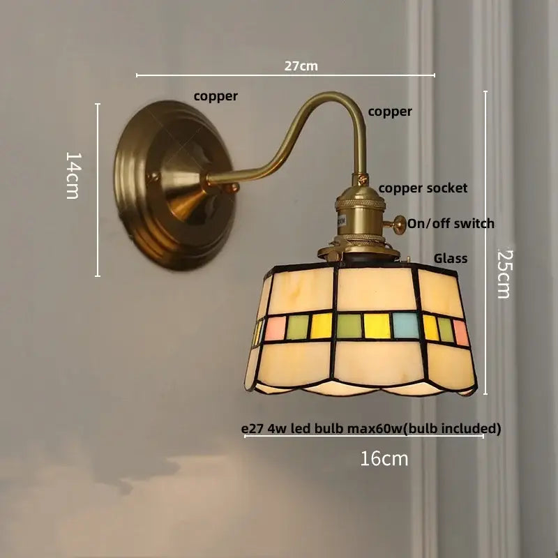 Antique teal glass and brass wall light fixture with stained glass shade and geometric patterns for bedroom use
