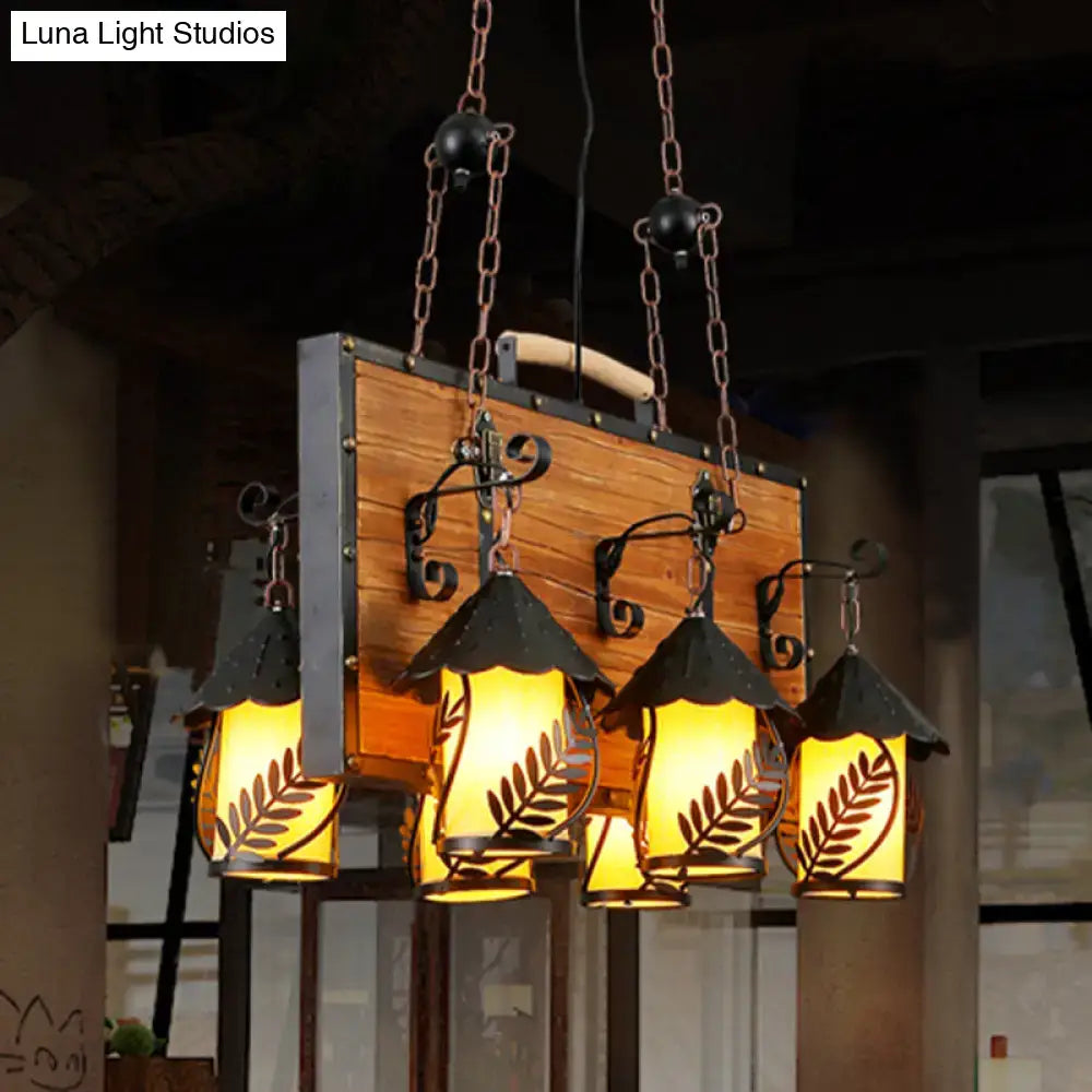 Rustic wooden and metal antique white dining room chandelier with six lights and clear leaf-patterned glass shades