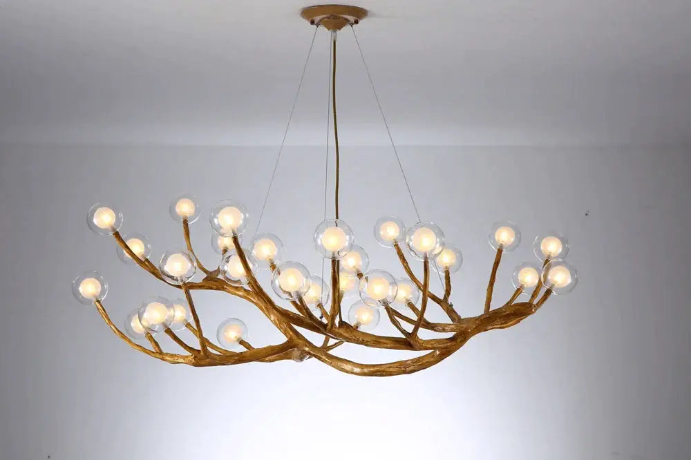 Gold-toned pendant light with branching antler design and clear glass bubble led bulbs for dining room decorbites glass bubble