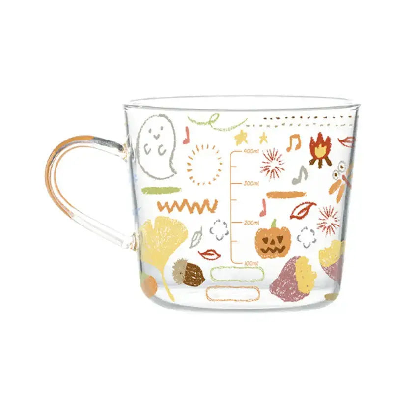 Clear glass 500ml glass mug with apricot and orange autumn pattern featuring pumpkins leaves and musical notes