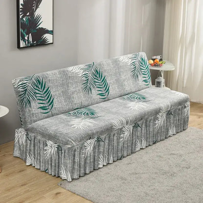 Gray sofa cover with green and white tropical leaf pattern and ruffled hem for elastic armless futon bed use