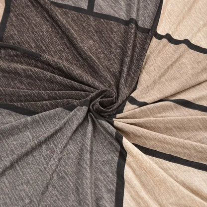 Argyle beige and dark gray elastic armless futon sofa cover with soft textured geometric pattern and bold black lines