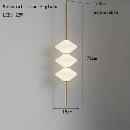 Art deco pendant light with three stacked white glass shades and brass iron frame for dining room illumination