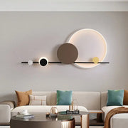 Modern art deco led circular wall sconce with black bar and white brown yellow illuminated circles for dining room decorbites art deco