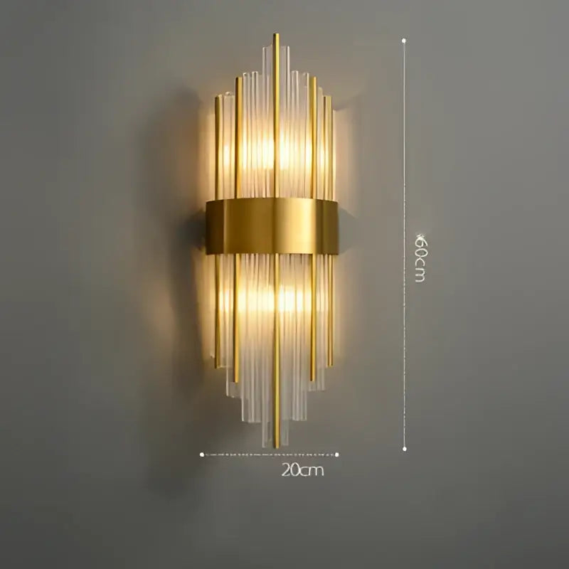 Gold-toned wall sconce with vertical ribbed glass rods and central brass band decorbites art deco stainless design