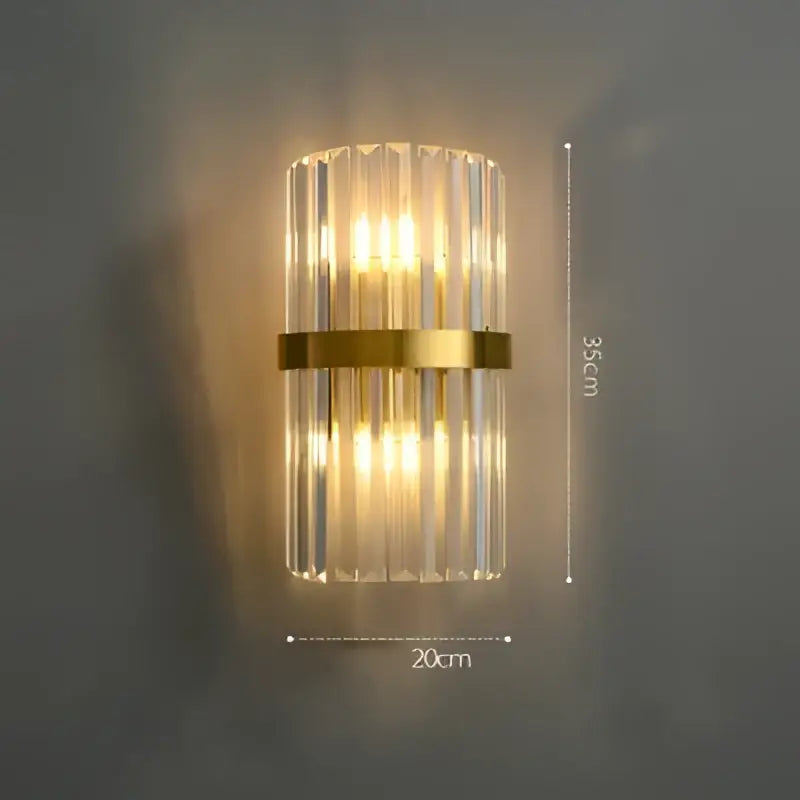 Modern art deco stainless wall sconce with vertical crystal prisms gold-toned band decorbites wall sconce for bedroom