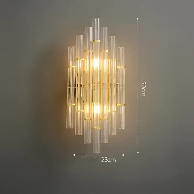 Gold-toned decorbites art deco stainless wall sconce with clear ribbed glass tubes in a vertical cascading design for bedroom decor